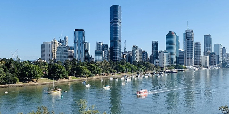 Bright ink and toner printer cartridges in an office with a view of Brisbane